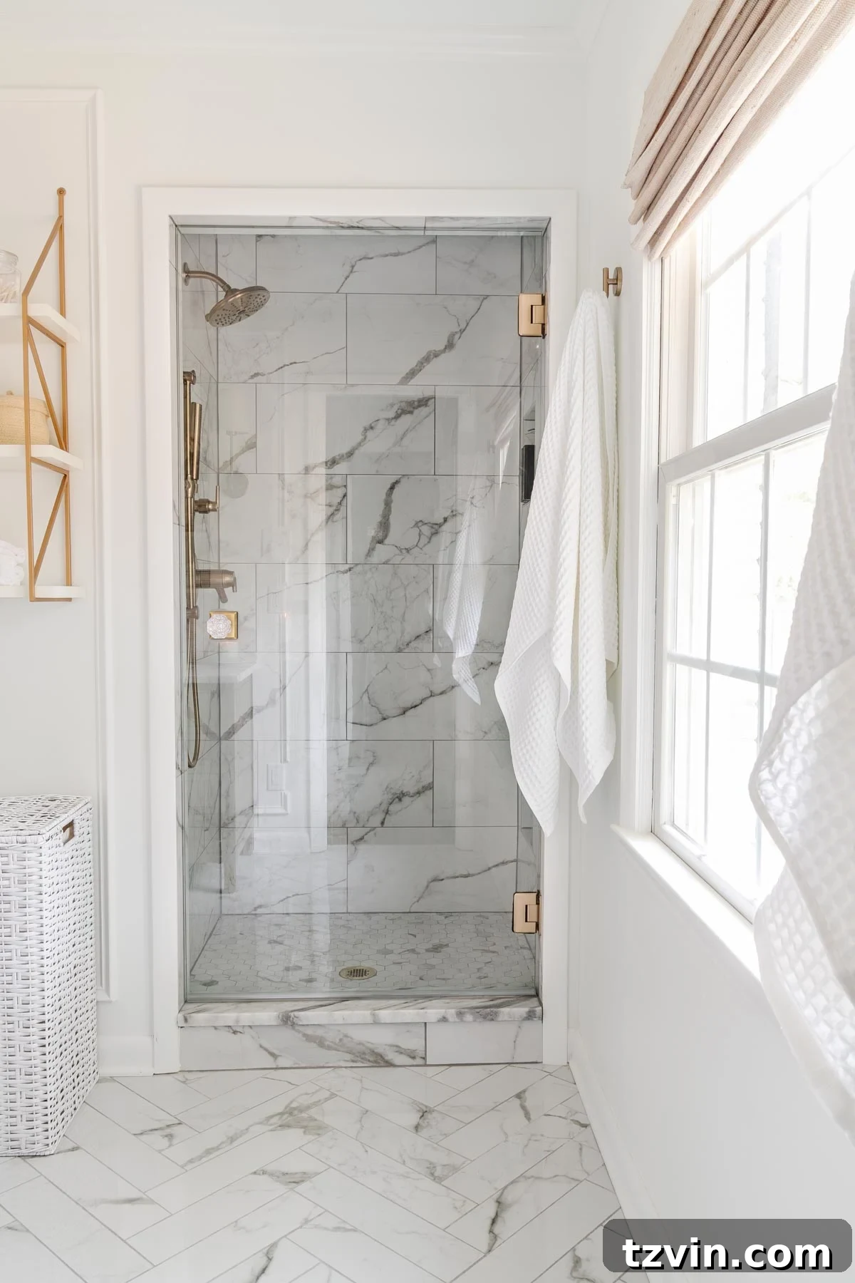 14 Brilliant Hacks to Make Your Small Bathroom Feel Spacious 9 A bathroom with a frameless glass shower enclosure, showing how it contributes to an open feel.