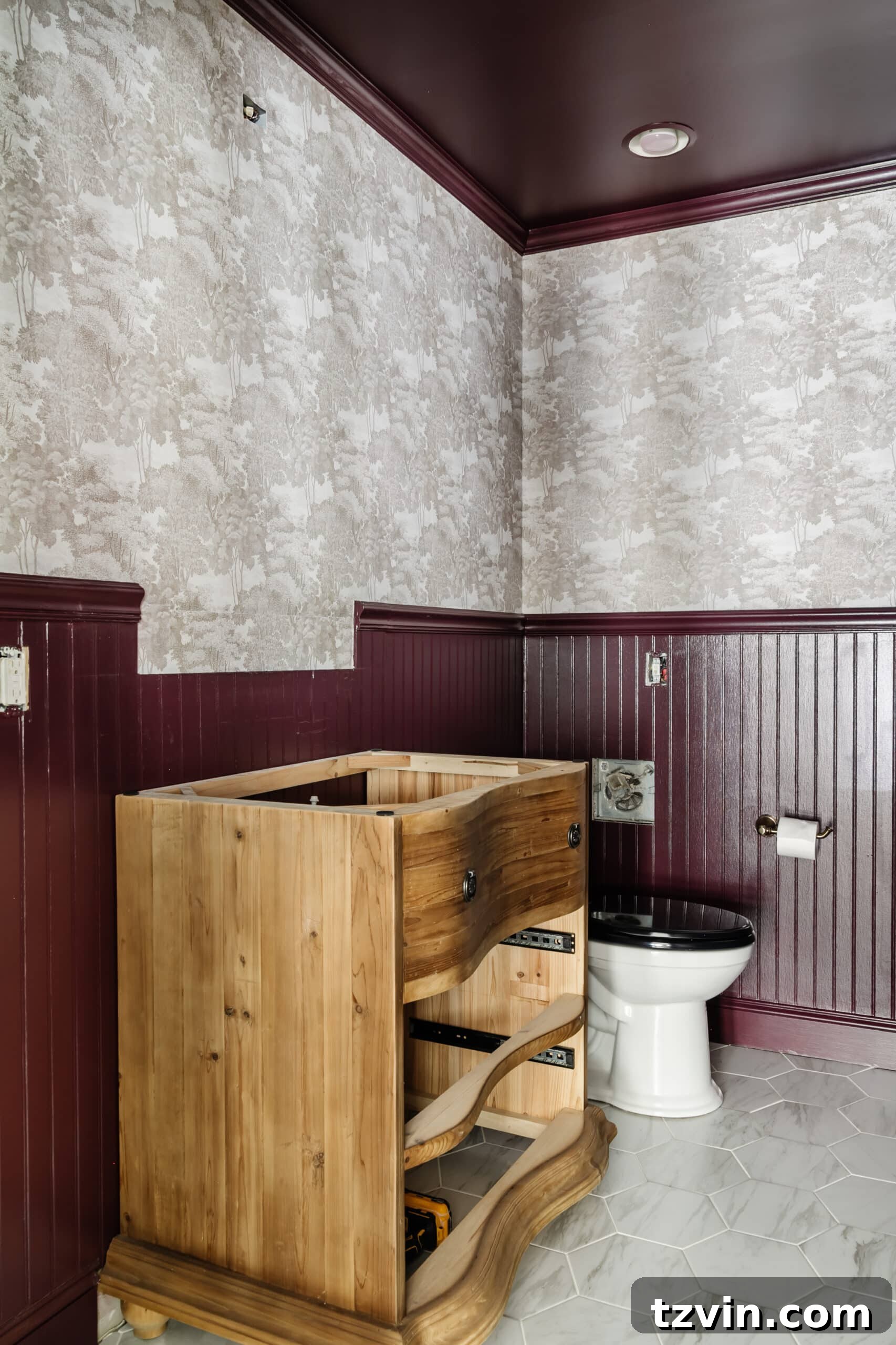 Farrow & Ball Brinjal paint with modern toile wallpaper Saint Sebastian in a powder room