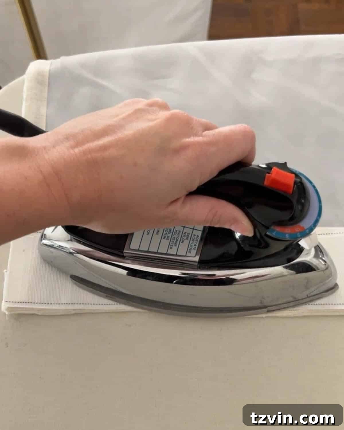 Chic No-Sew Curtains: Easy DIY with Designer Trim 11 Ironing on a no-sew curtain header tape for a structured, tailored finish