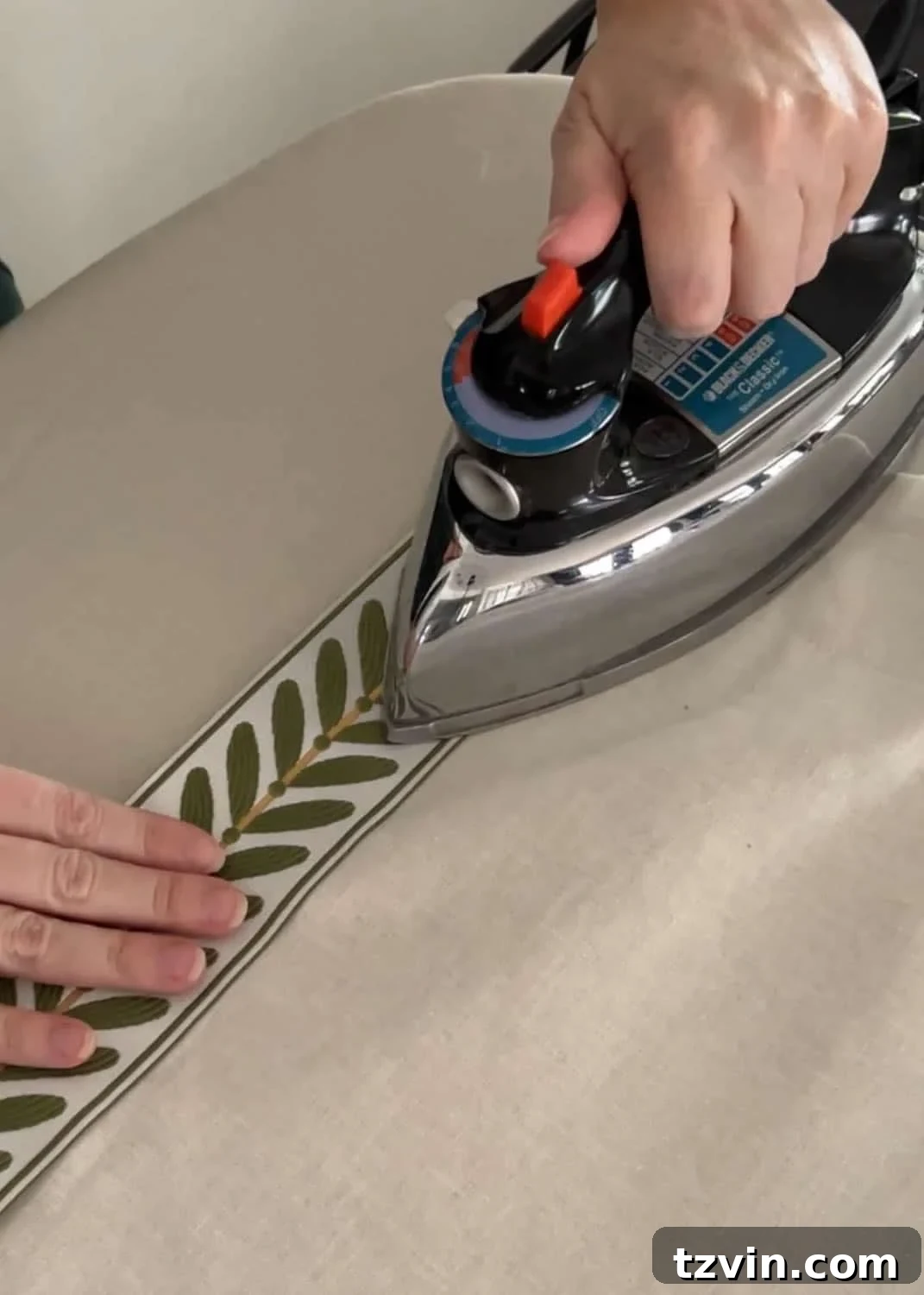 Chic No-Sew Curtains: Easy DIY with Designer Trim 15 Applying no-sew curtain trim with hemming tape and an iron for a seamless finish