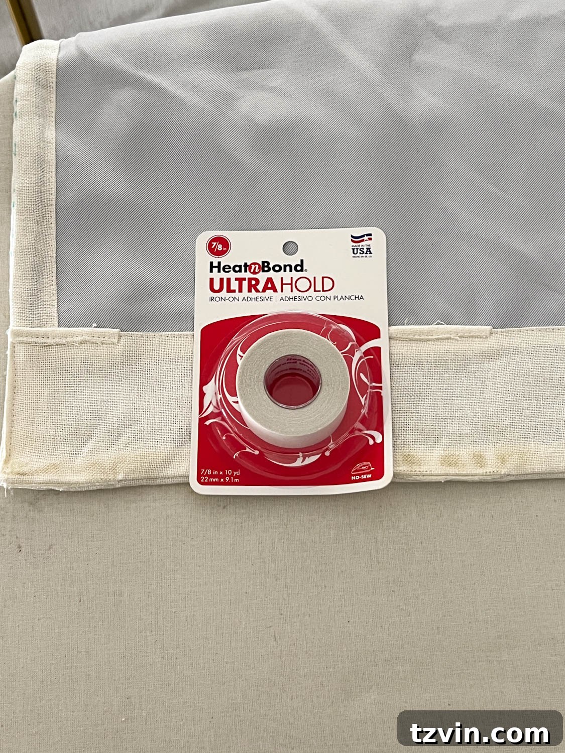 Chic No-Sew Curtains: Easy DIY with Designer Trim 8 Applying Heat n Bond hemming tape to the backside of a curtain header