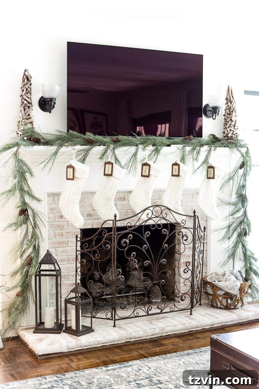 A simple minimalist Christmas mantel garland setting a serene and understated festive tone for the living room.