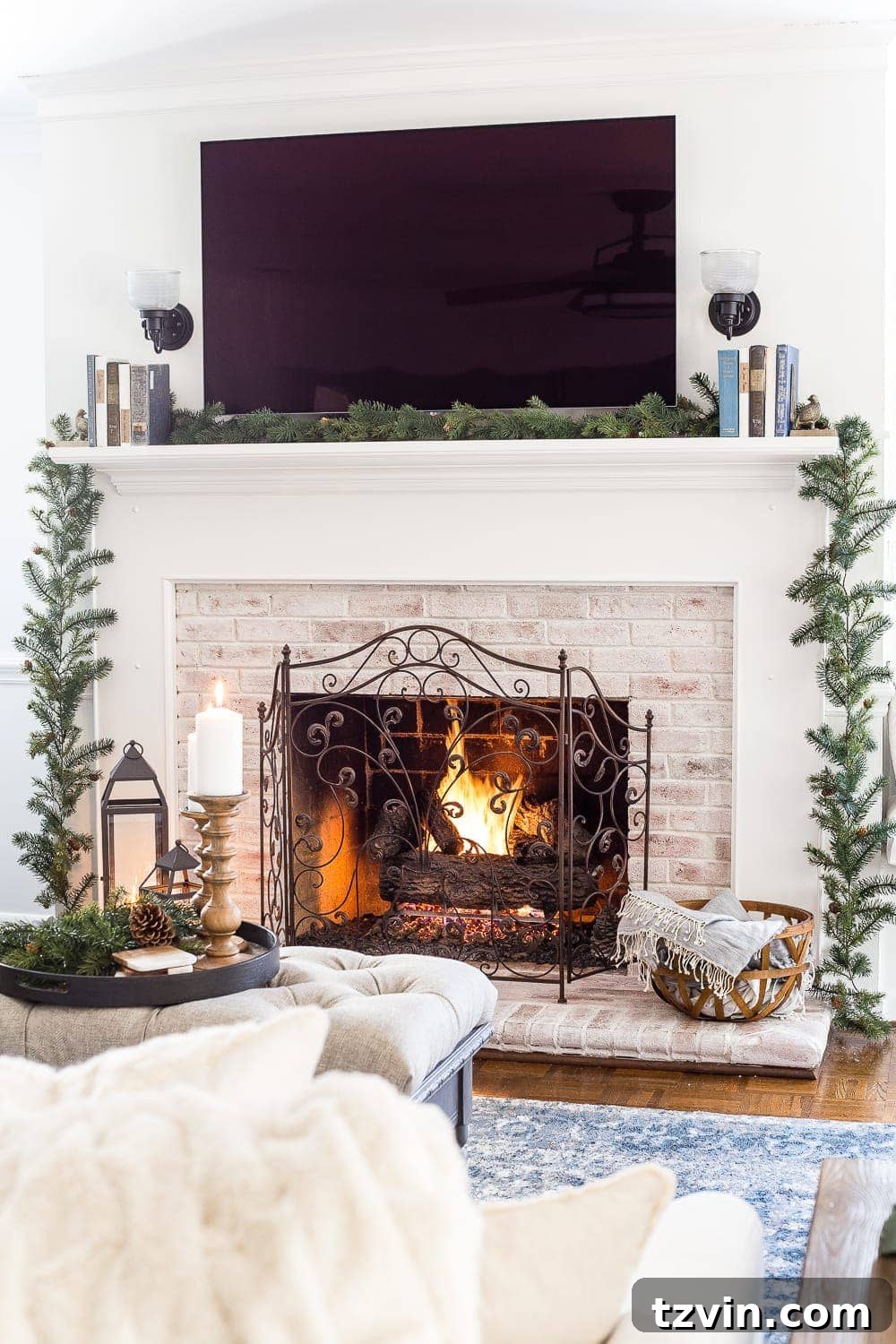 A simple yet elegant winter mantel featuring a base pine garland, setting the stage for festive embellishments and creating a cozy atmosphere.