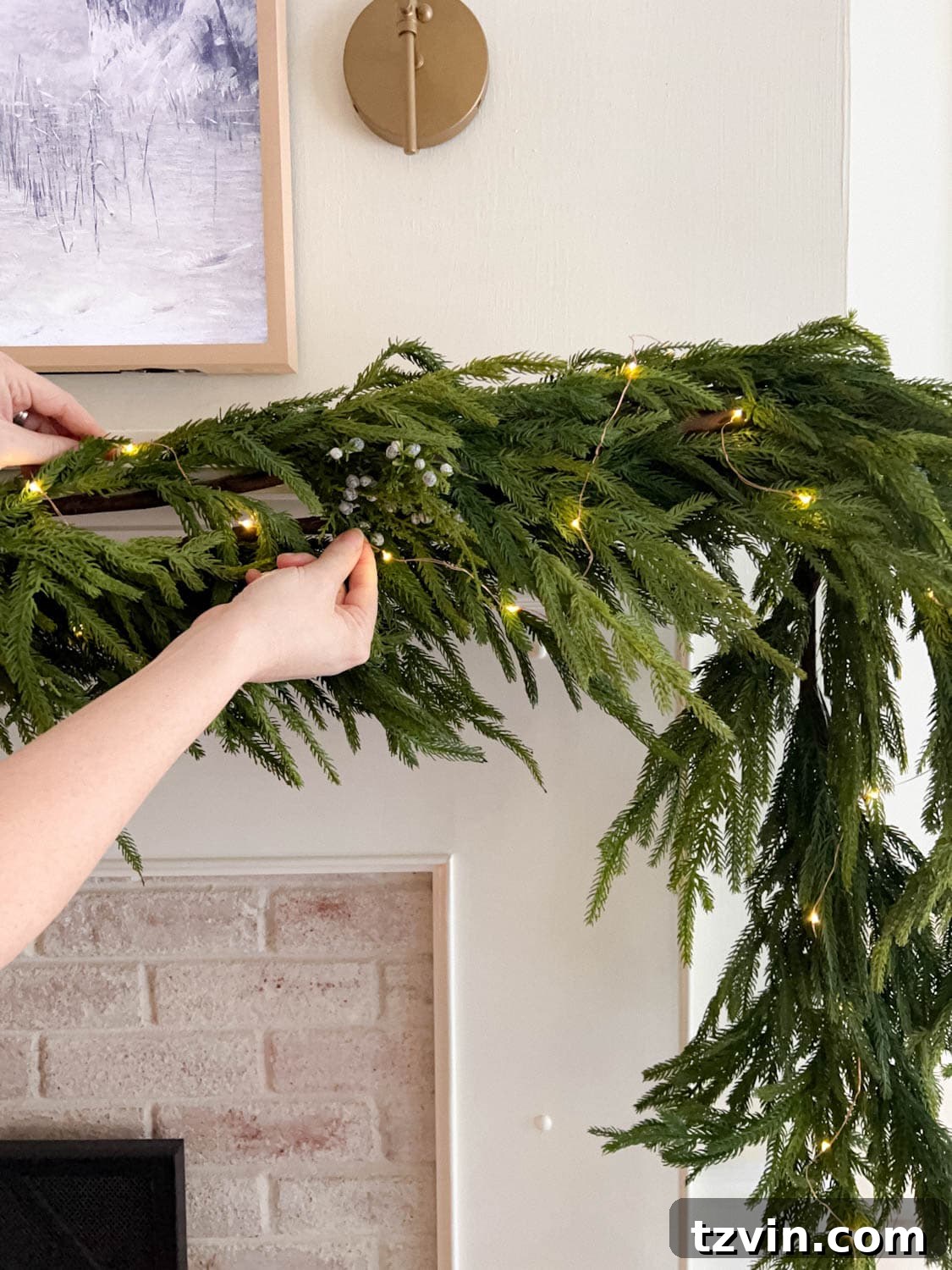 A detailed image demonstrating how to effectively weave fairy lights into a Christmas garland, ensuring even distribution and a warm, inviting glow.