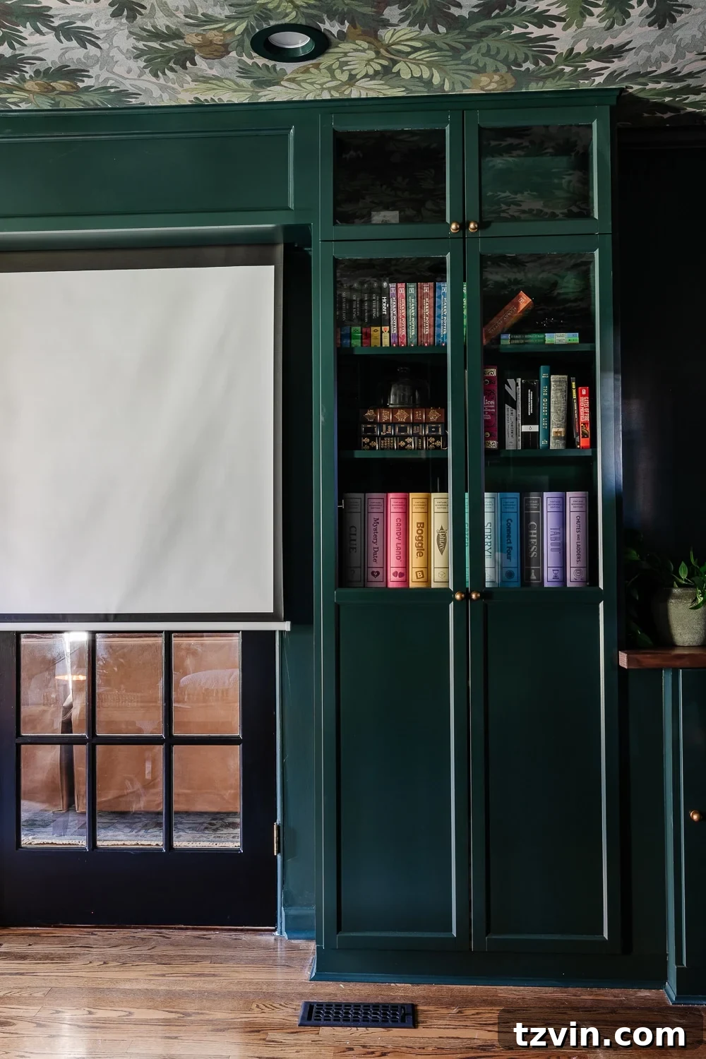Your Dream Home Cinema DIY on a Dime 9 IKEA billy bookcase built in with glass front oxberg doors and motorized movie screen