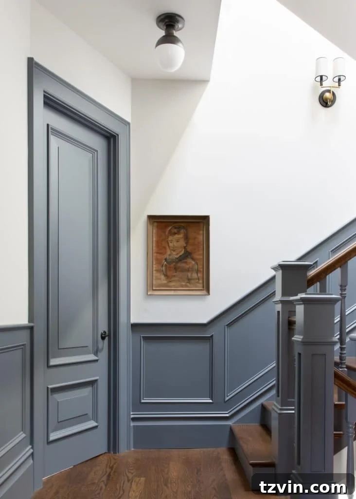 staircase with blue contrast trim and white walls
