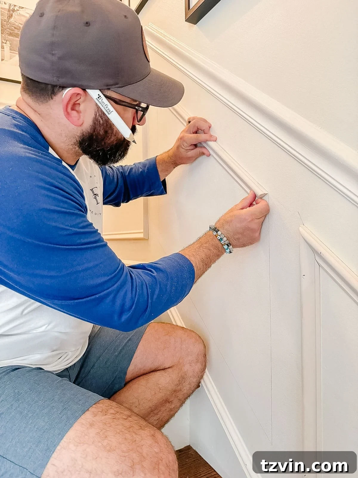 Stair Wainscoting Made Simple: A DIY Installation 13 Installing picture frame molding on stairs with precision and care