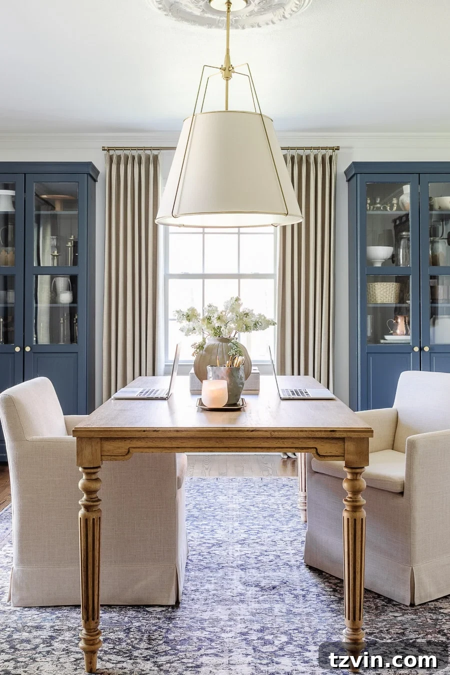 Boost Your Output: Smart Home Office Designs 3 Functional home office layout for two with a large work table and comfortable rolling chairs