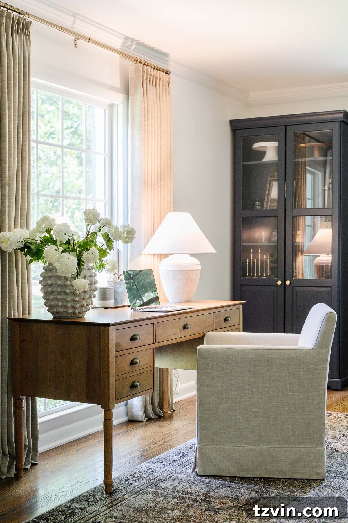 Boost Your Output: Smart Home Office Designs 6 Productive home office desk setup facing a window with a stylish table lamp