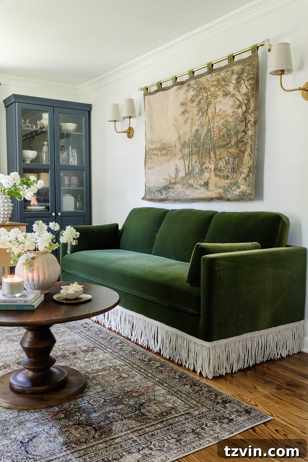 Boost Your Output: Smart Home Office Designs 9 Luxurious green velvet sofa with elegant fringe detail, part of a functional home office