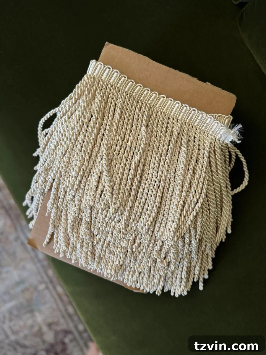 Close-up detail of luxurious cream bullion fringe trim