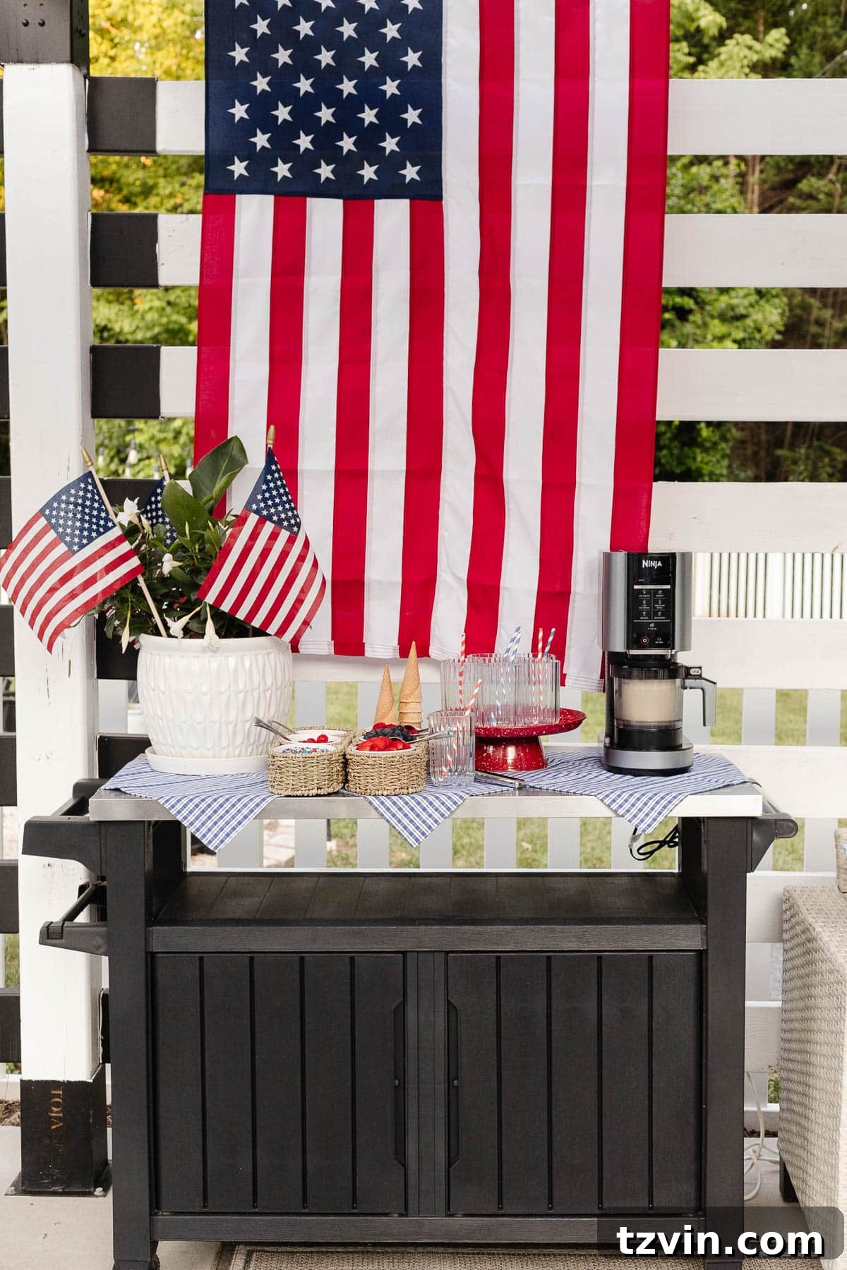 Stars and Stripes Sundae Station Made Easy 9 Easy 4th of July decor on an ice cream sundae bar, featuring a planter with flags and blue gingham napkins.