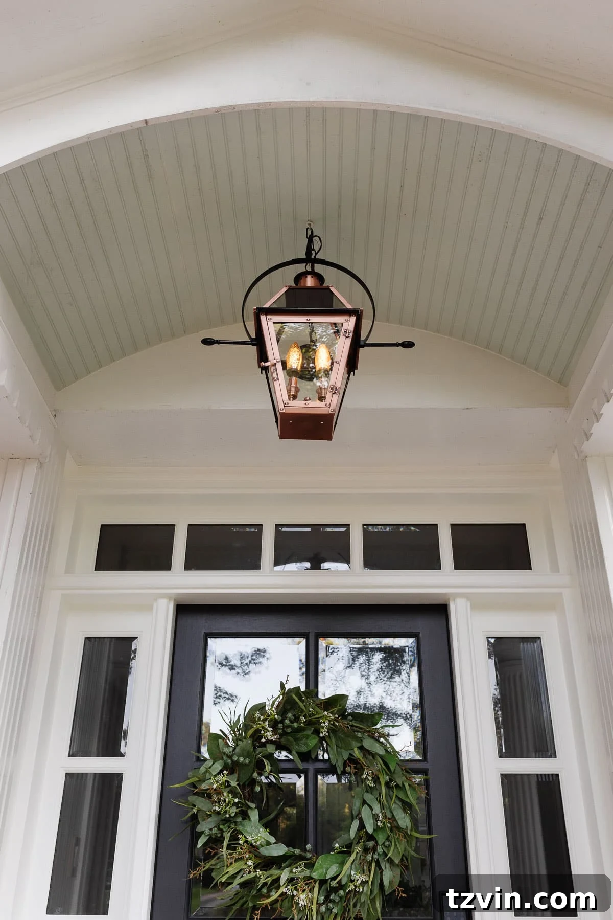 Top 4 Flame Effect Light Bulbs for a Realistic Gas Lantern Glow 3 flickering flame light bulb in a lantern on a front porch