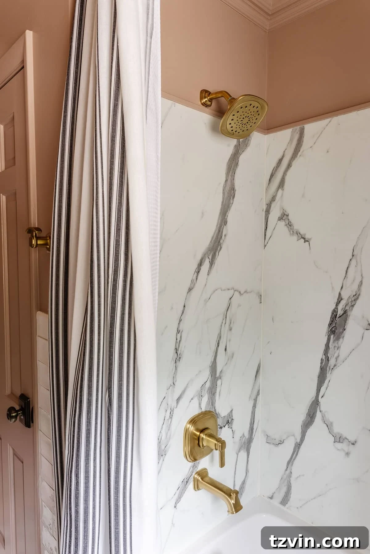 A beautifully installed extra-long shower curtain hanging high in a modern bathroom, featuring soft fabric that gracefully touches the floor, creating a sense of luxury and space.