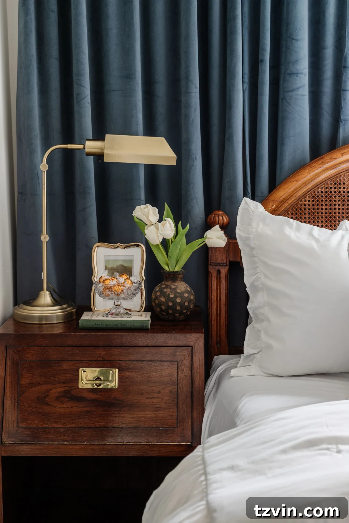 glass footed bowl used as a candy dish on a guest bedroom nightstand