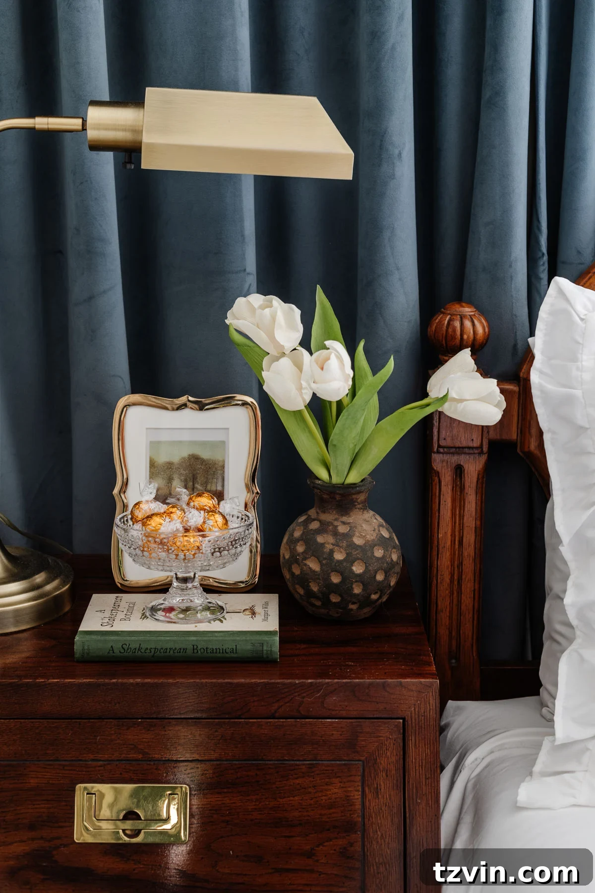glass footed bowl used as a candy dish on a guest bedroom nightstand