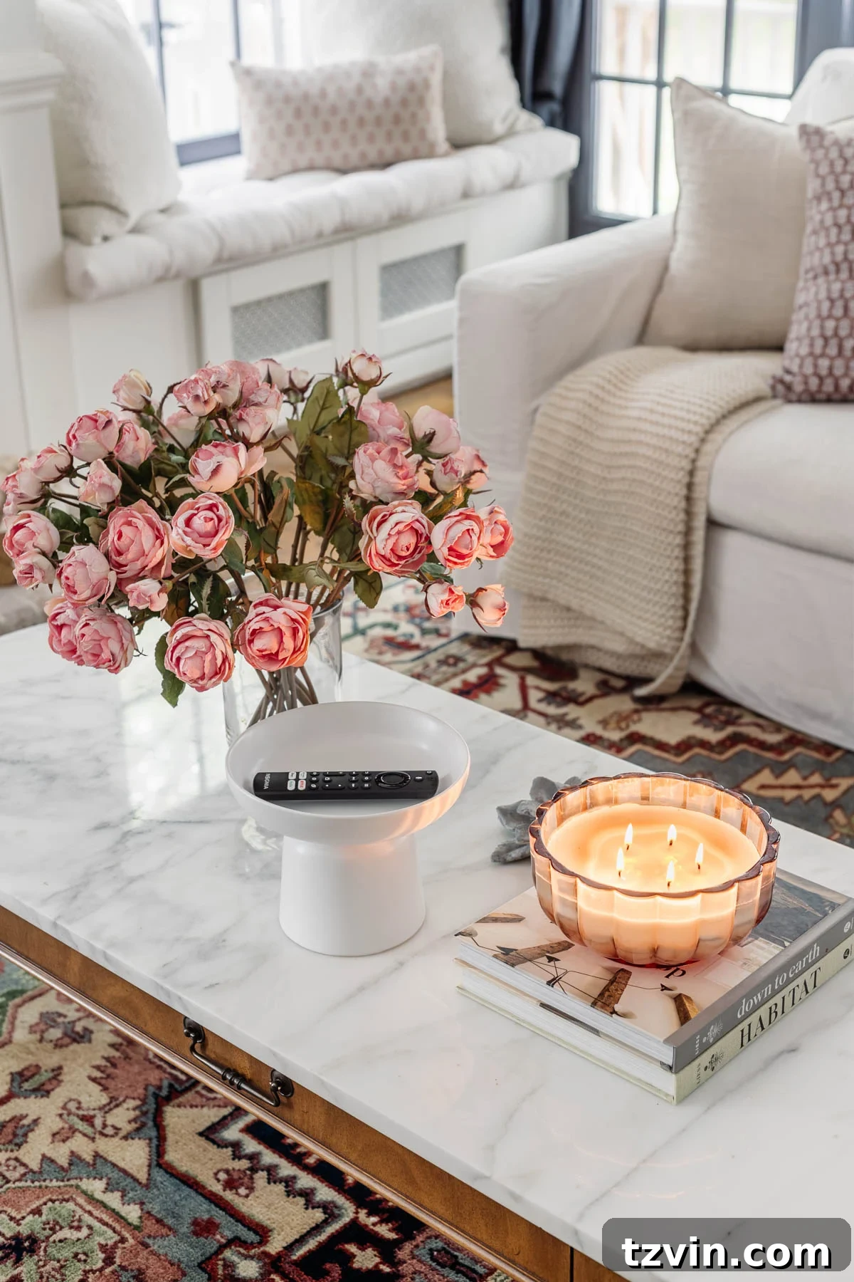pedestal bowl used as a remote control holder on a coffee table