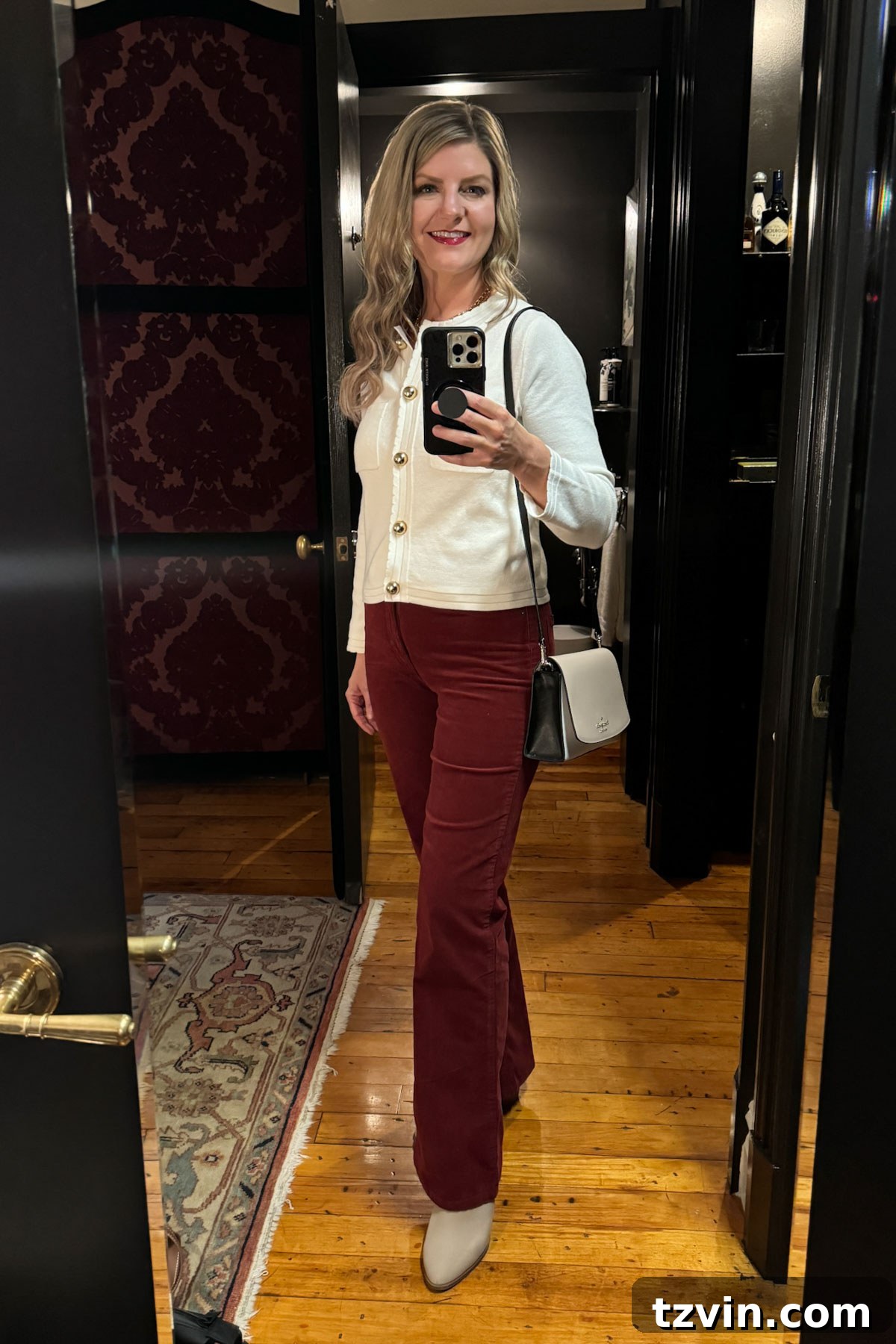 outfit with red corduroy pants and white cropped sweater
