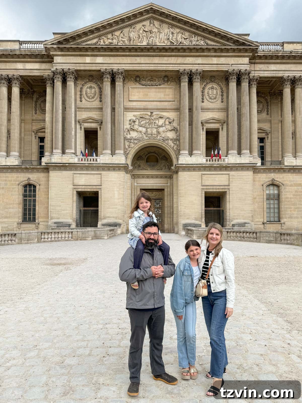 family in front of the Louvre