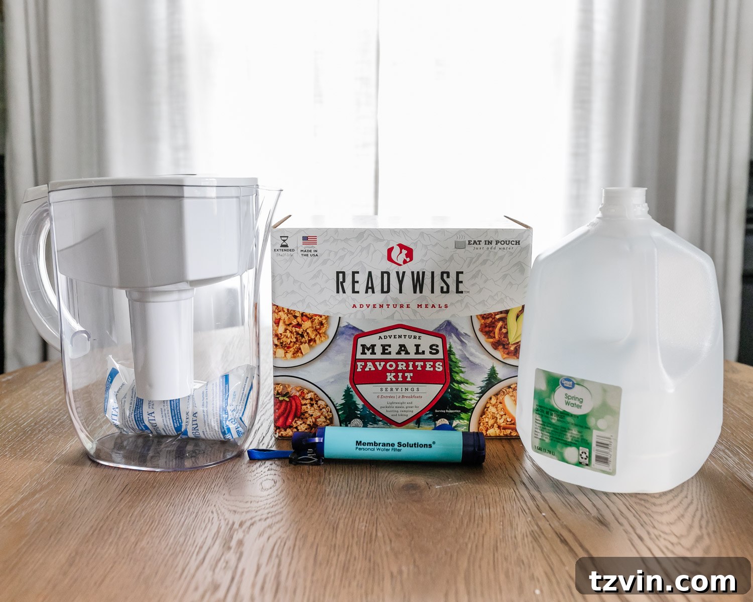 The Ultimate Home Disaster Readiness Kit 4 Various emergency food and water supplies, including water jugs, filters, and long-term food kits, for disaster preparedness.