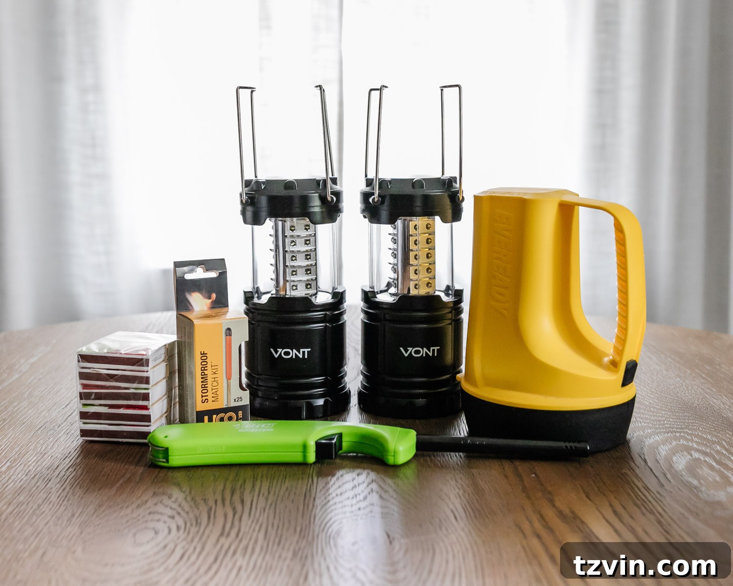 The Ultimate Home Disaster Readiness Kit 6 Emergency heat and light sources, including a camping lantern, stormproof matches, and a portable wood-burning stove, for disaster situations.