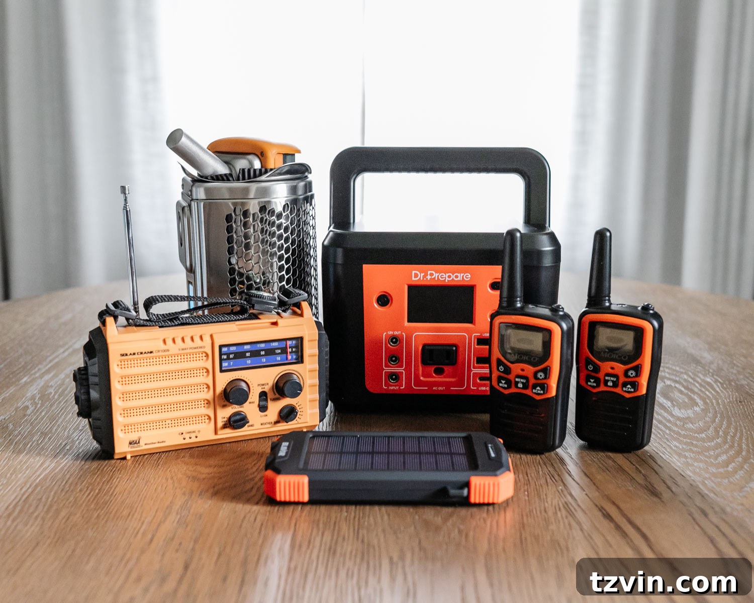 The Ultimate Home Disaster Readiness Kit 7 Emergency communication and power devices, including a solar phone charger, generator, walkie-talkies, and a solar hand-crank radio.