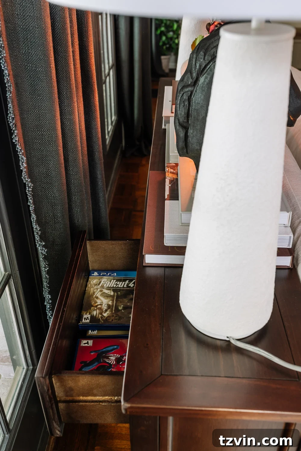 The Sofa Table Mistake You're Making 3 PlayStation game storage in a living room console table drawer