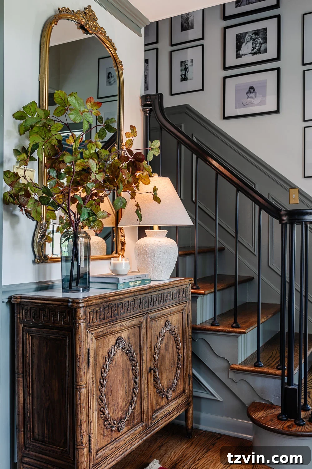 Elevate Your Entryway: Stylish Foyer Refreshes Under $300 7 foyer decorating ideas with credenza styled with lamp, vase of stems, books, and candle
