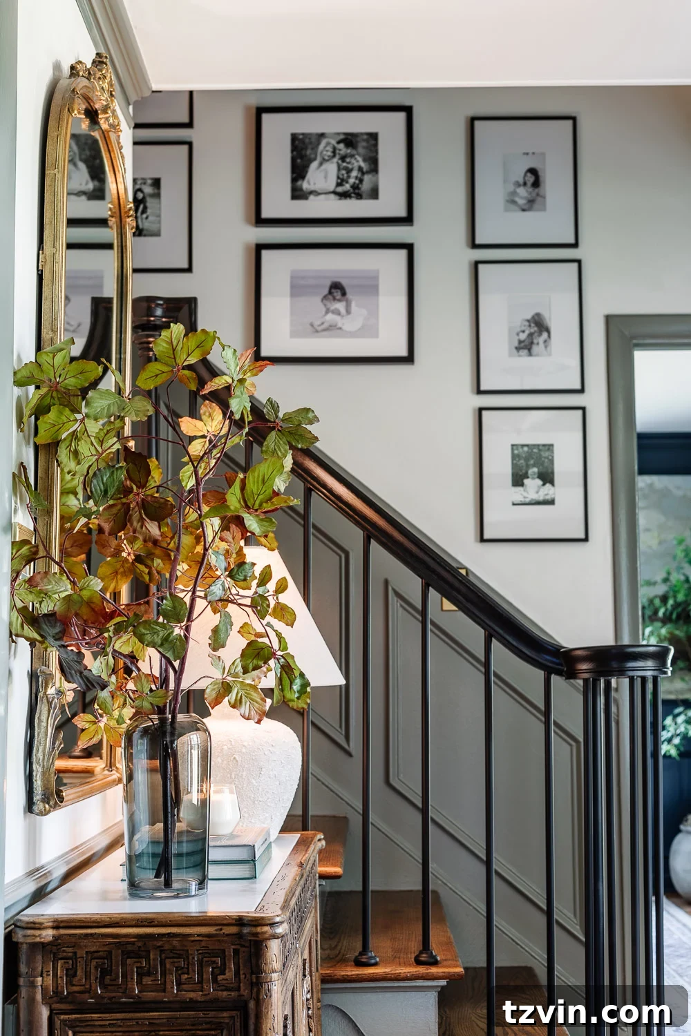 Elevate Your Entryway: Stylish Foyer Refreshes Under $300 9 vase of tall fall stems on entryway table credenza and family gallery wall on staircase
