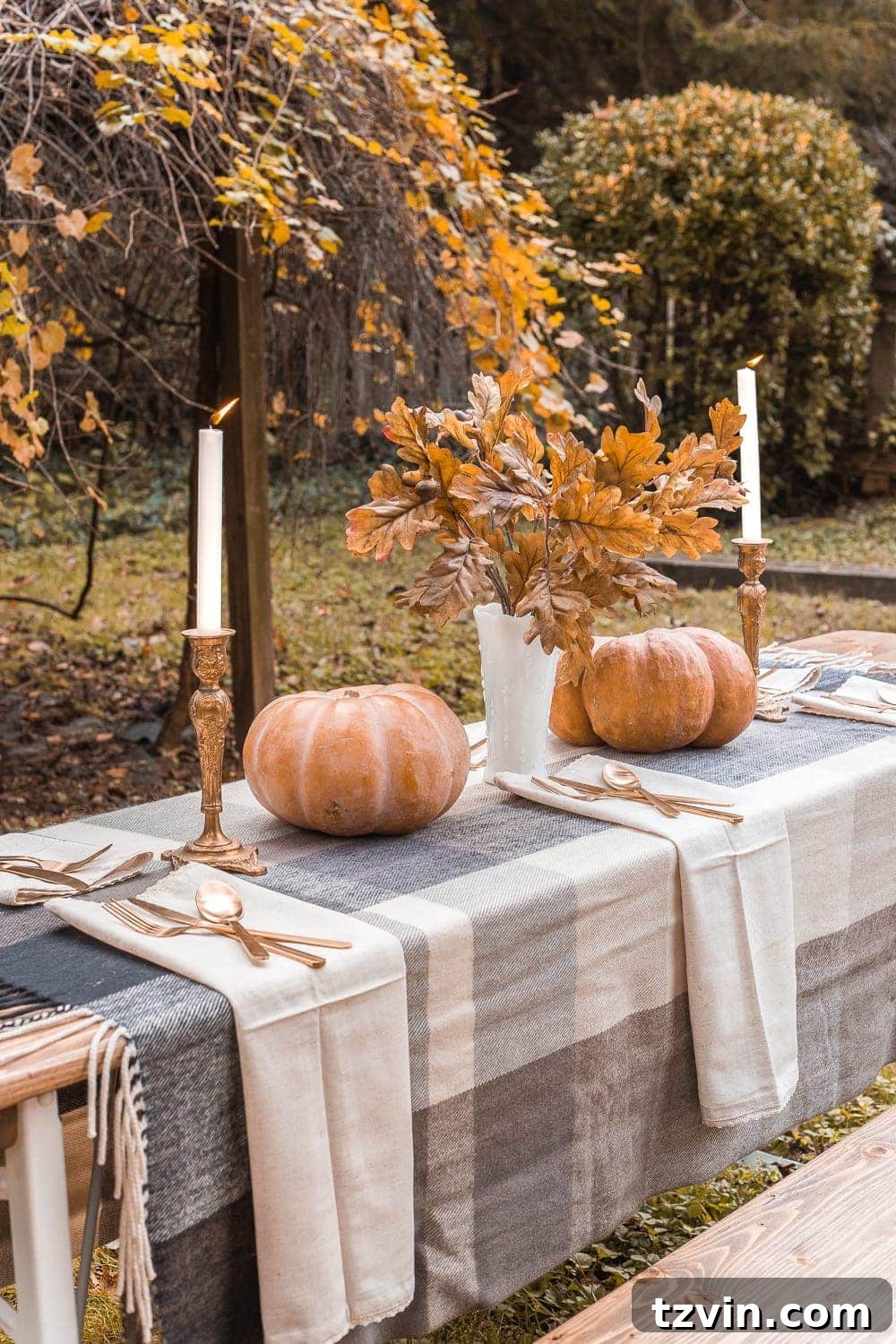 throw blanket used as a tablecloth for fall decor
