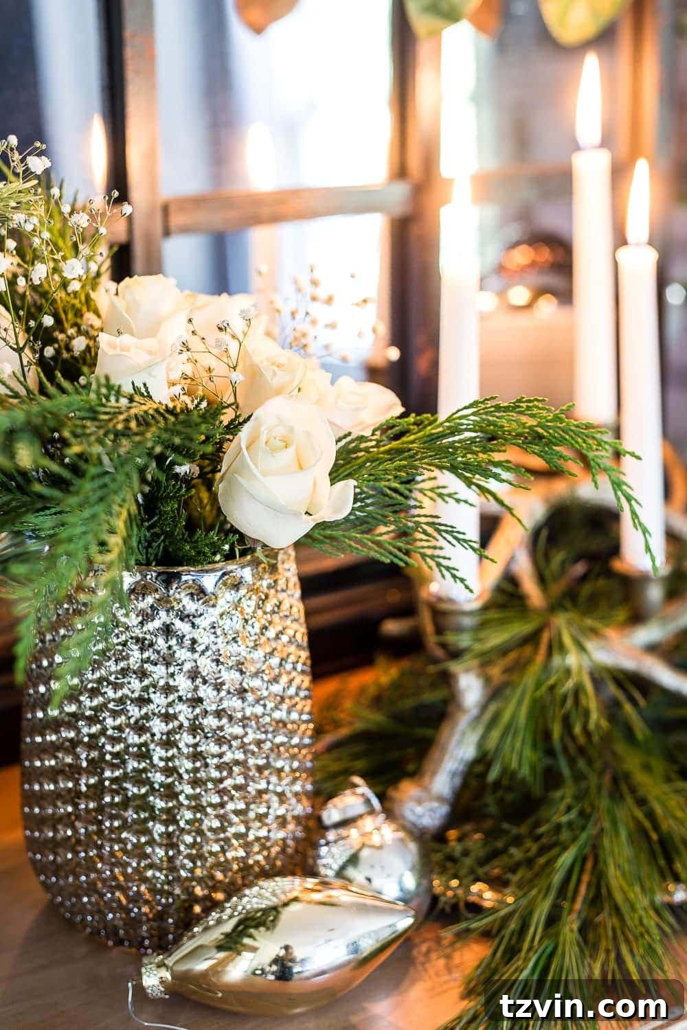 Festive Christmas floral arrangement with fresh cedar and white roses, adding elegance and fragrance