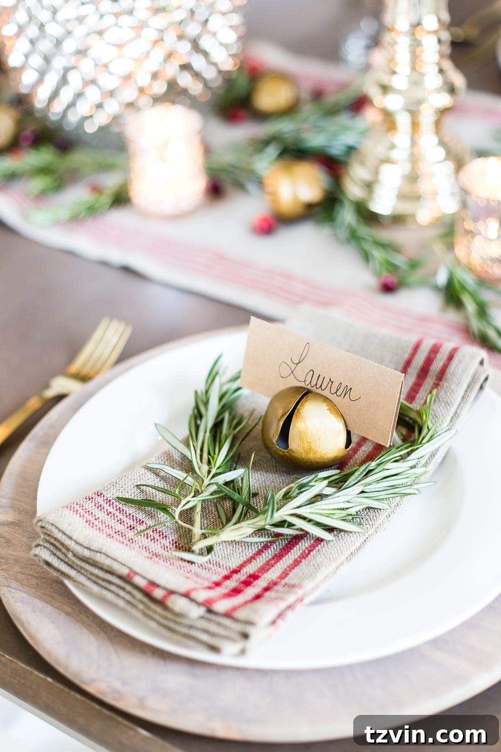 Mini rosemary heart wreath on a place setting for an elegant Christmas table