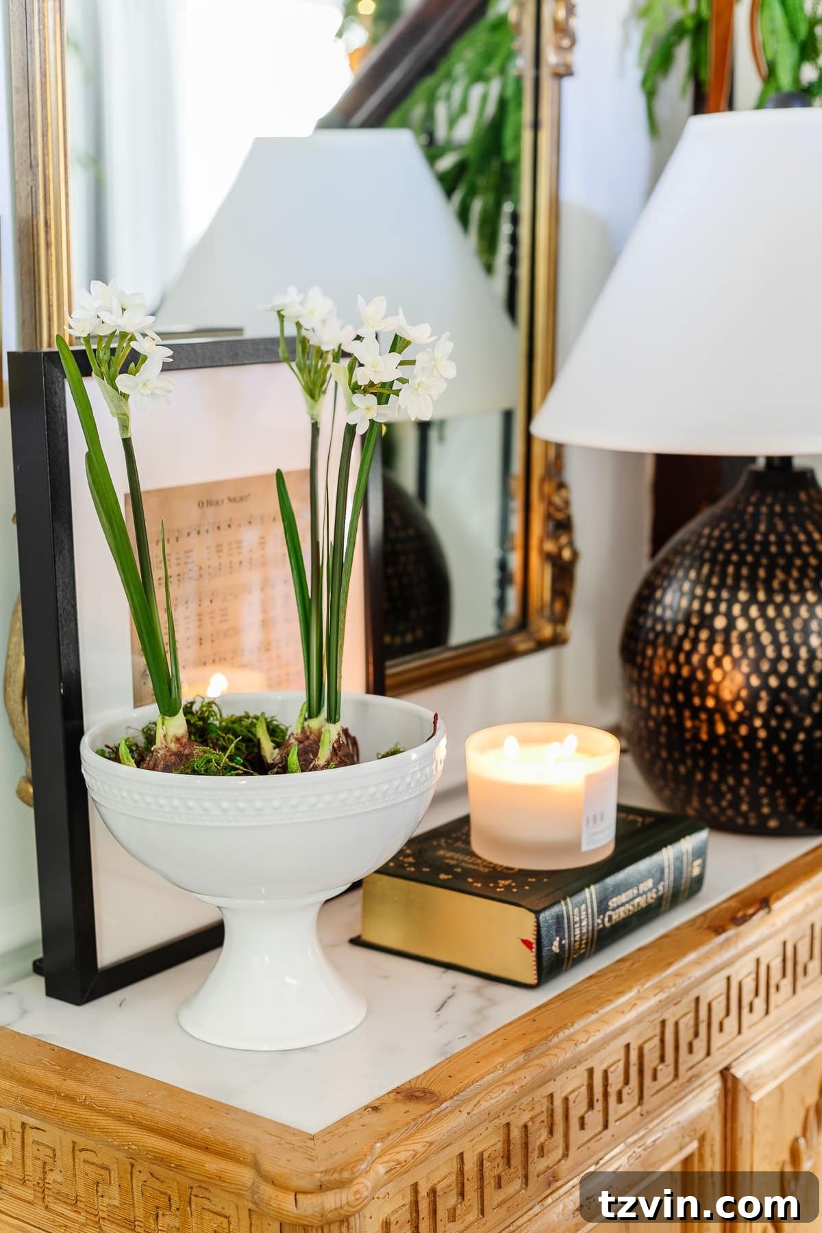 Elegant bowl of paperwhite flowers blooming on an entryway table, adding fresh winter beauty to Christmas decor