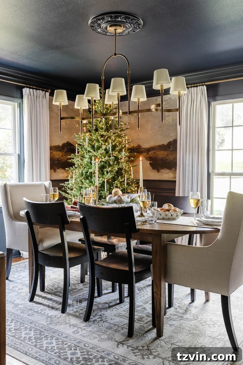 navy blue dining room decorated for Christmas with mural walls