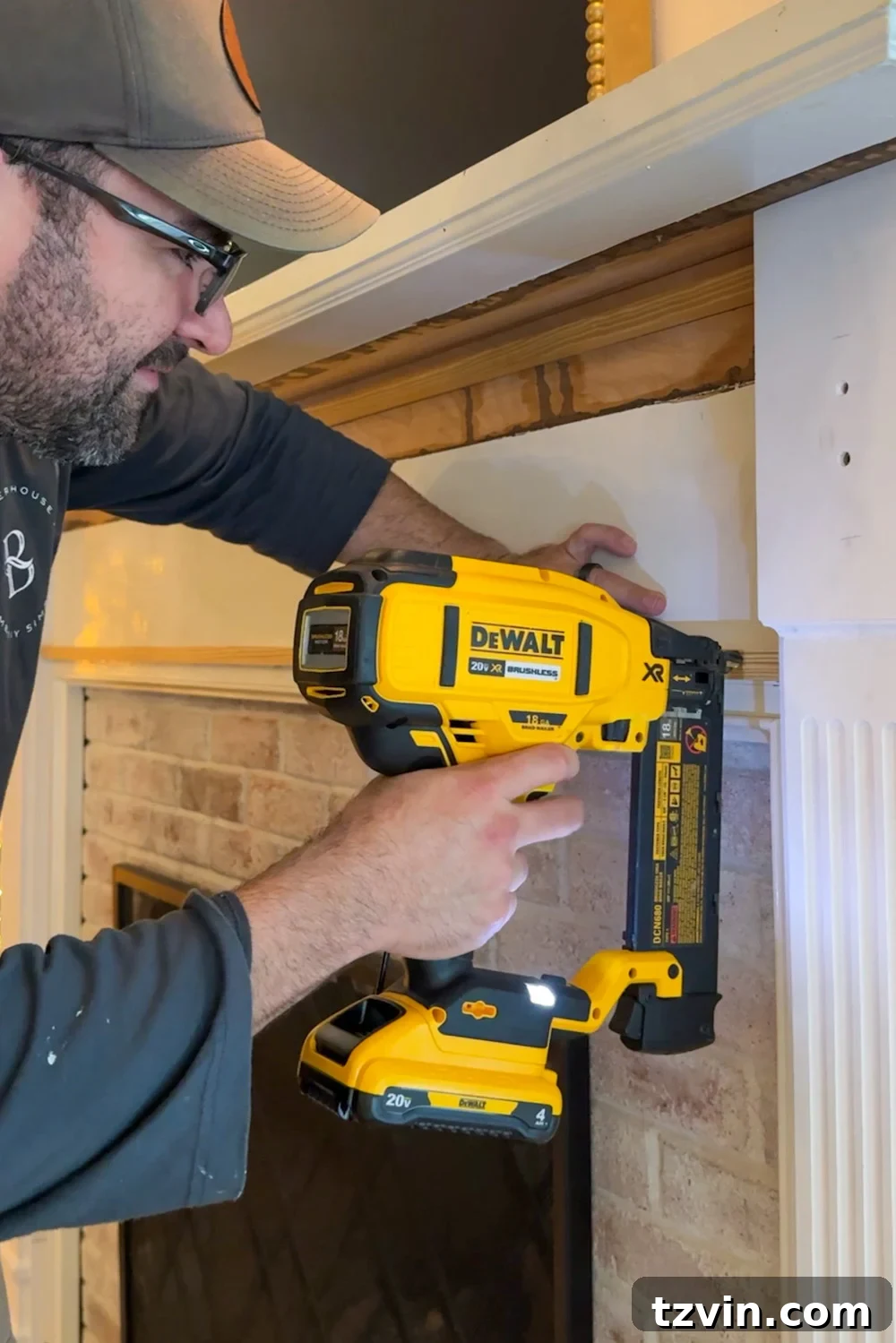 Classic Style DIY Fireplace Molding Transformation 12 Attaching 1x board to fireplace with nail gun
