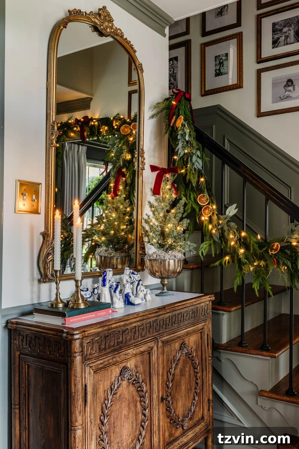 entryway cabinet with blue and white nativity set and candles decorated for Christmas