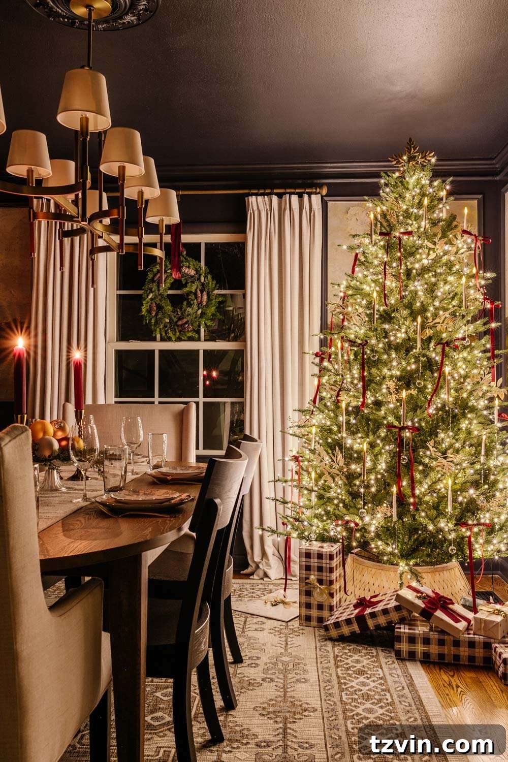 Enchanting dining room scene with a Christmas tree sparkling at night, enhanced by soft candlelight.