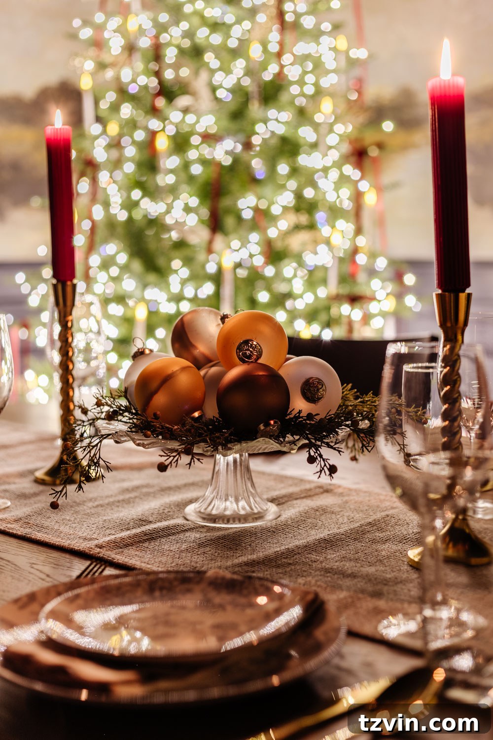A tastefully decorated candlelight Christmas dining room table, featuring an elegant centerpiece and festive atmosphere.