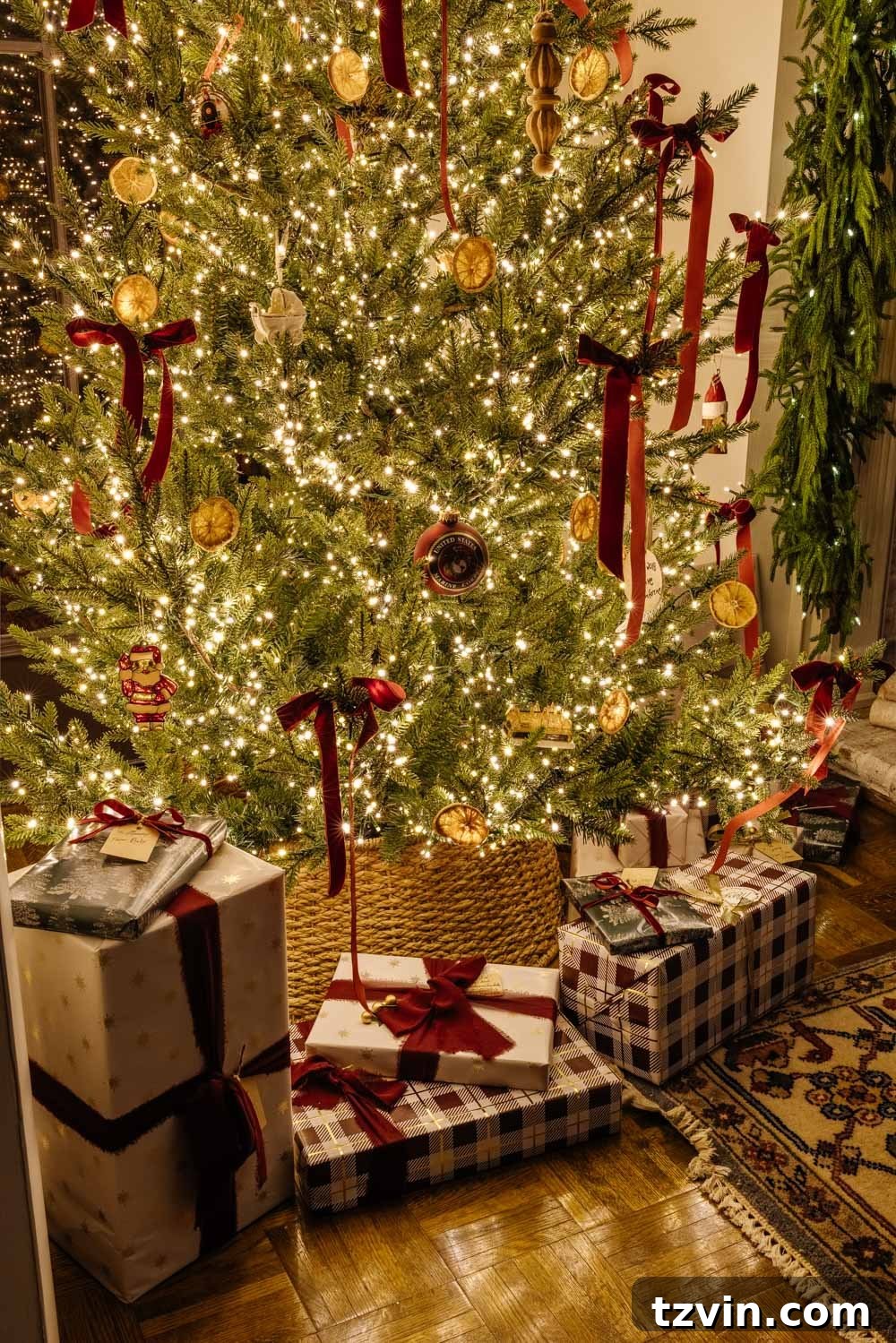 Beautifully wrapped gifts under a glowing candlelight Christmas tree, capturing the magic of the season.