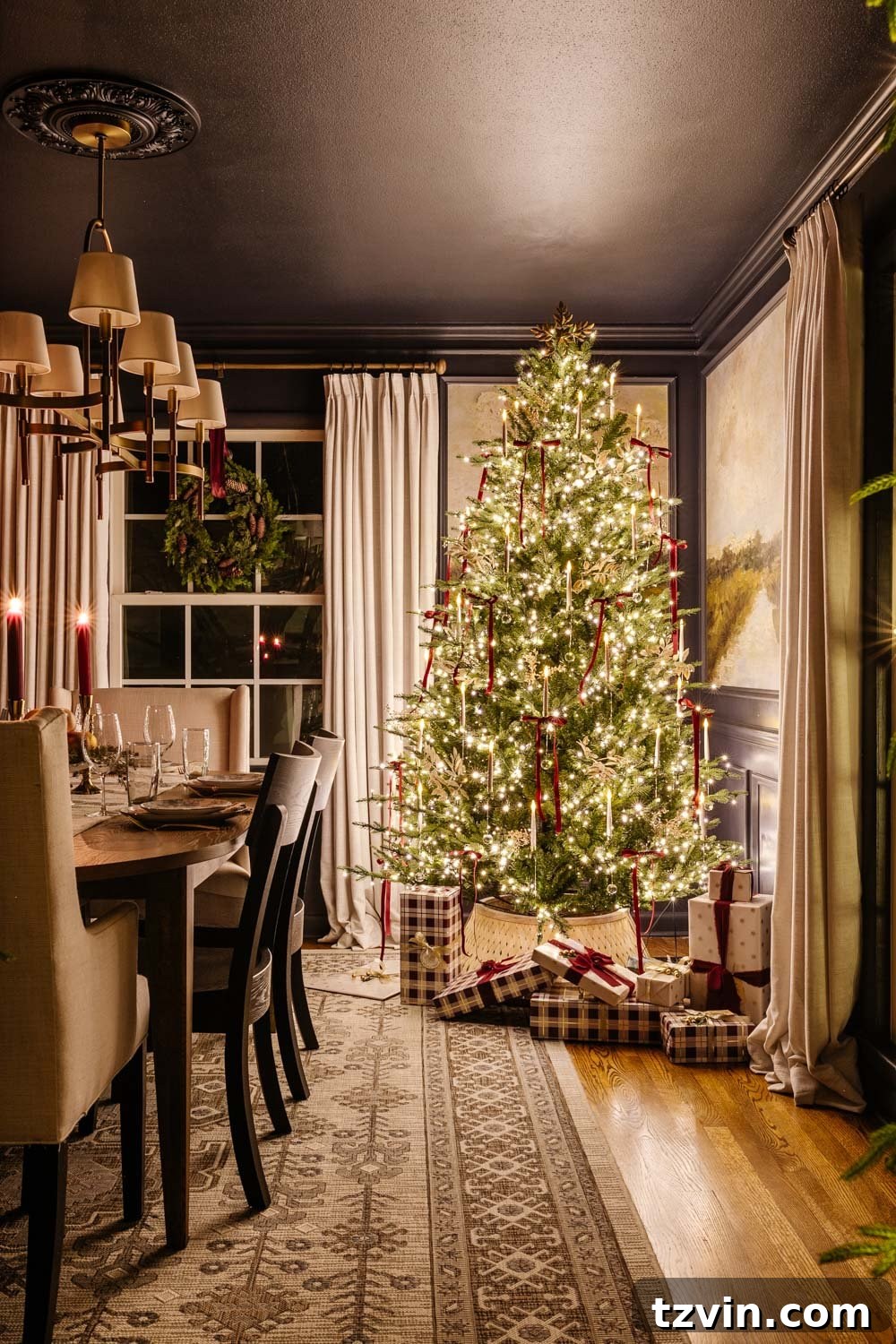 Dining room at night, with a majestically lit Christmas tree casting a warm glow by candlelight.