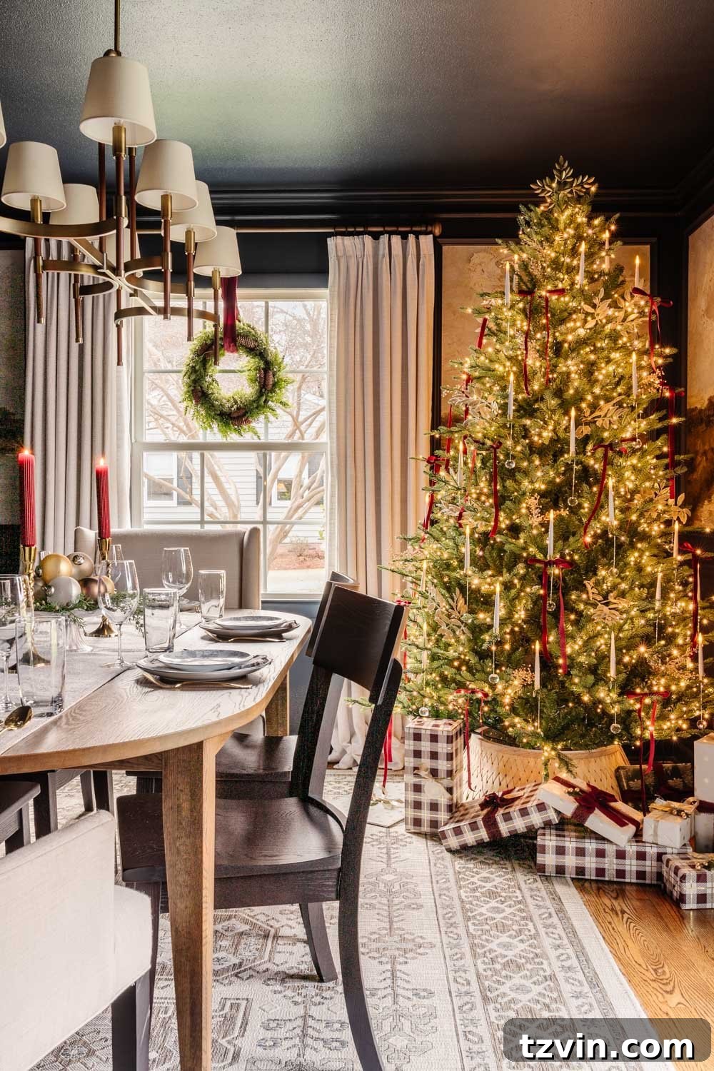 View of the dining room from the doorway, showcasing its modern colonial Christmas decor and elegant furniture.