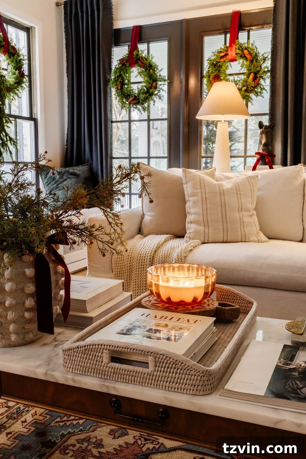 Cozy corner of a modern traditional Christmas living room, showing comfortable seating and subtle holiday accents.