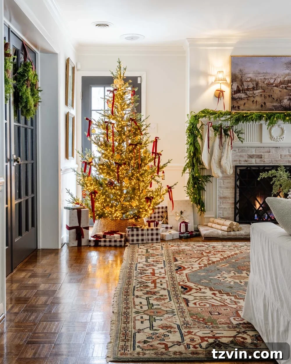 Elegant modern traditional colonial Christmas dining room view from the living area, showcasing cohesive holiday styling.