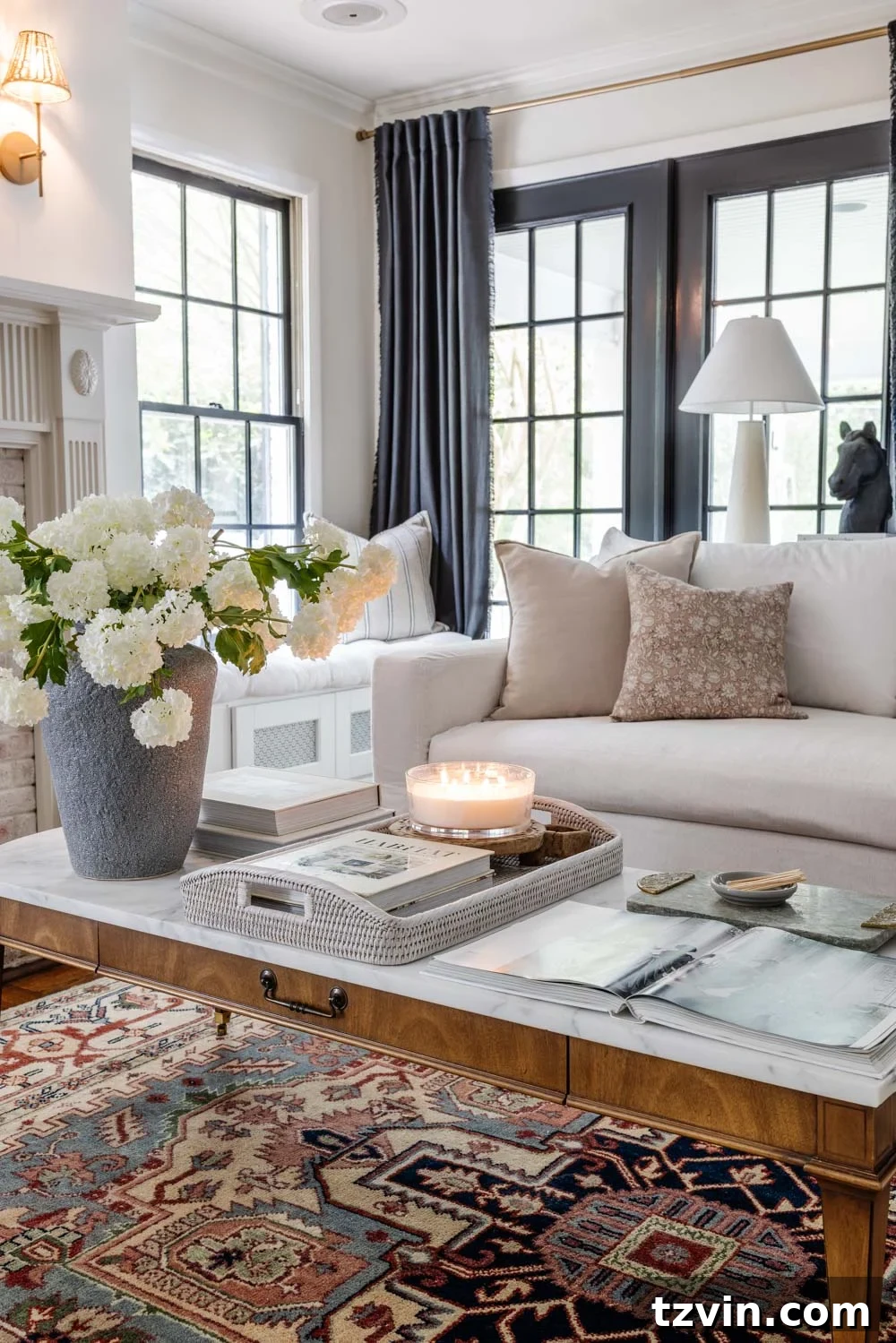 The Enduring 25: Furniture Masterpieces Immune to Passing Fads 2 classic furniture in a living room with coffee table decor and white sofa