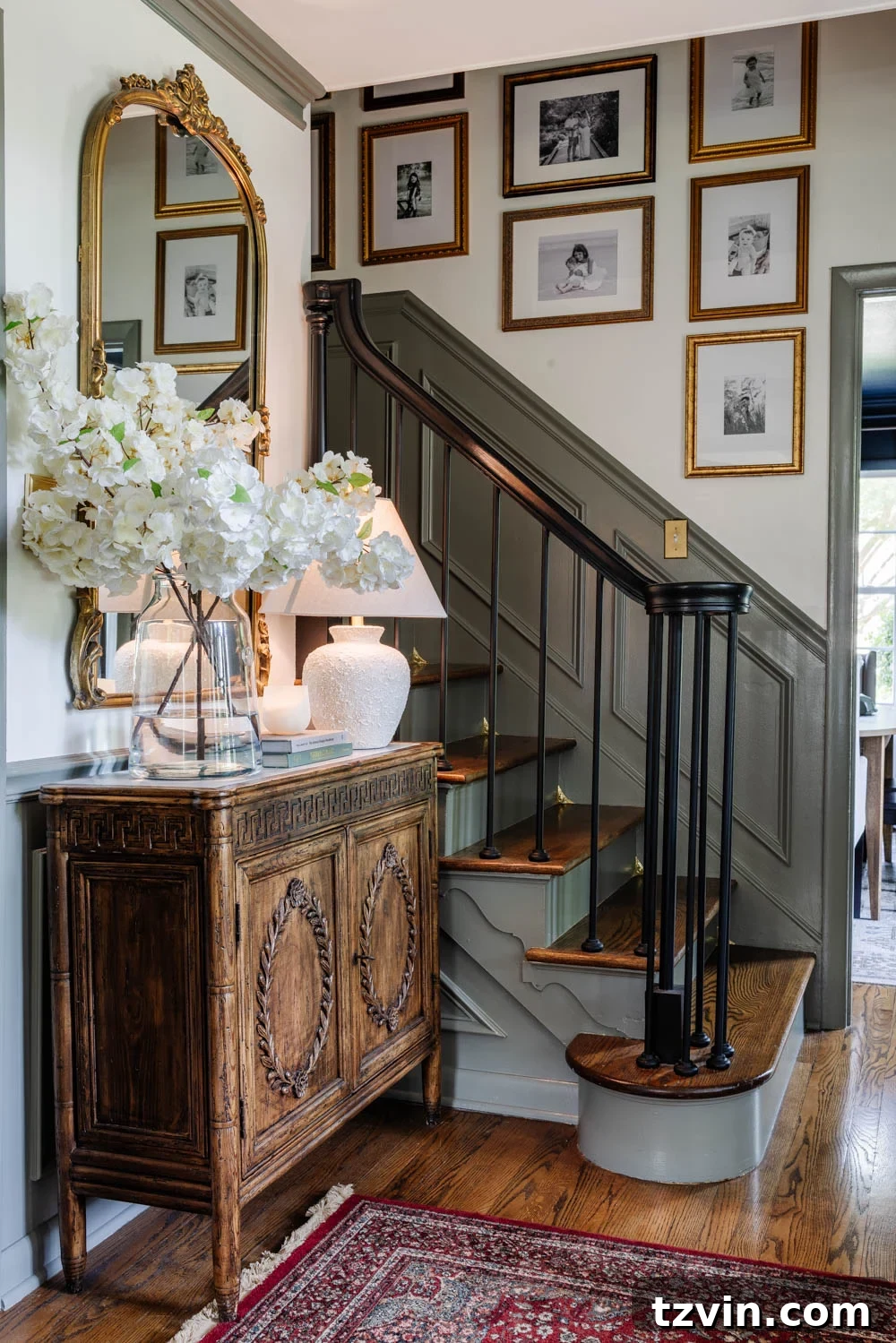 The Smart Way to Keep Your Stair Corners Dust-Free 2 Elegant foyer staircase featuring decorative dust corners and a stylish gallery wall