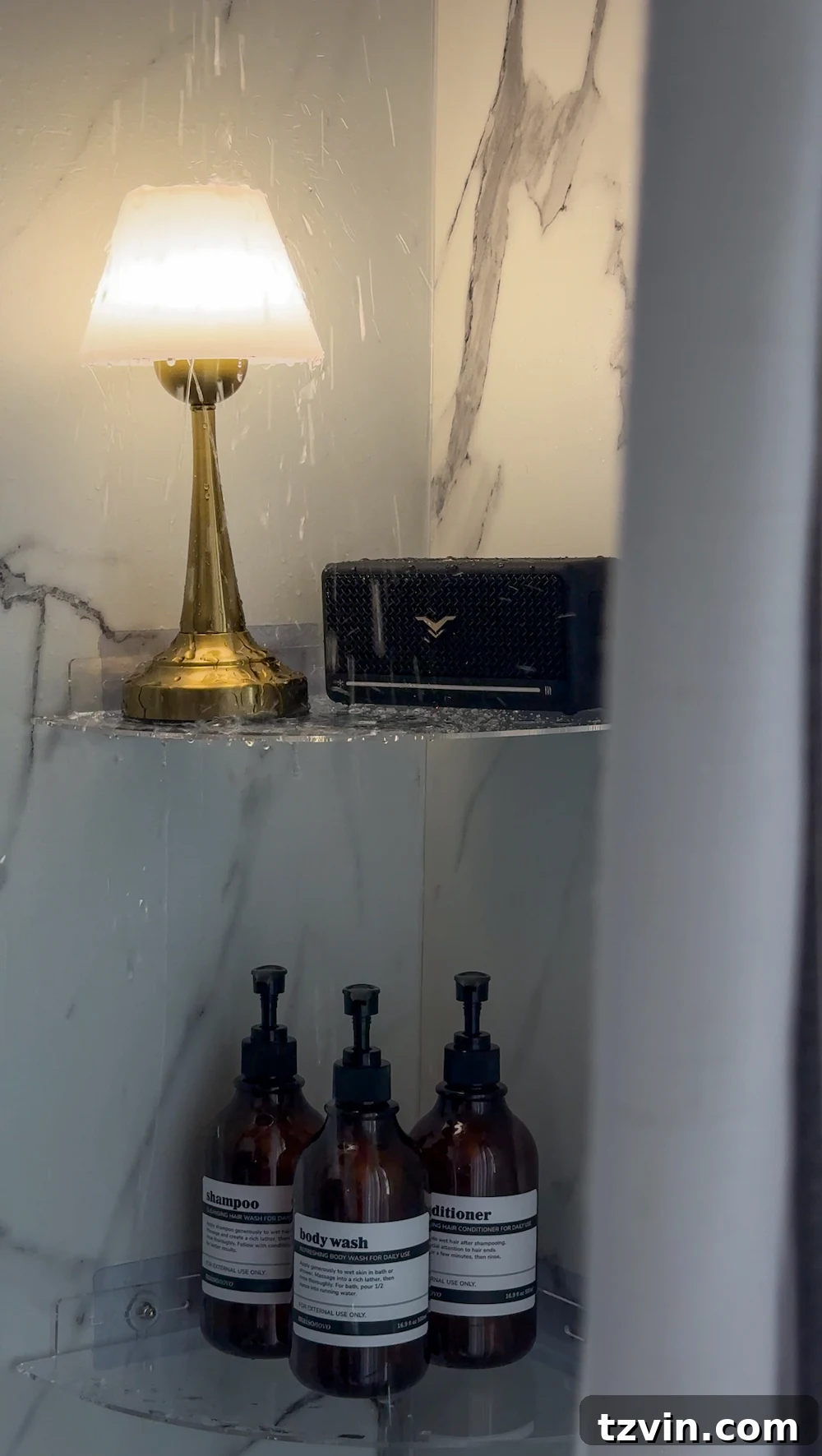The Coziest Shower Lights Trending Now 3 waterproof lamp on shower shelf with bluetooth speaker for a cozy bathroom