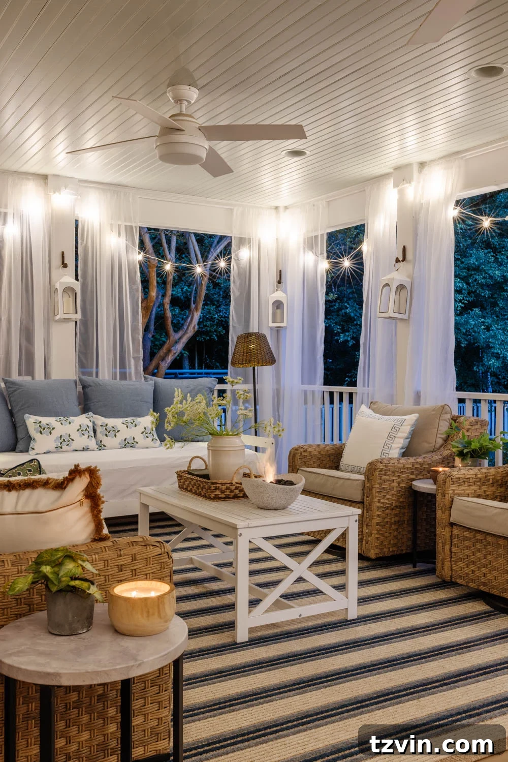 Our DIY Outdoor Living Room: Seamlessly Extending Our Home 11 Overhead view of stylish outdoor ceiling fans illuminating a back porch living space.