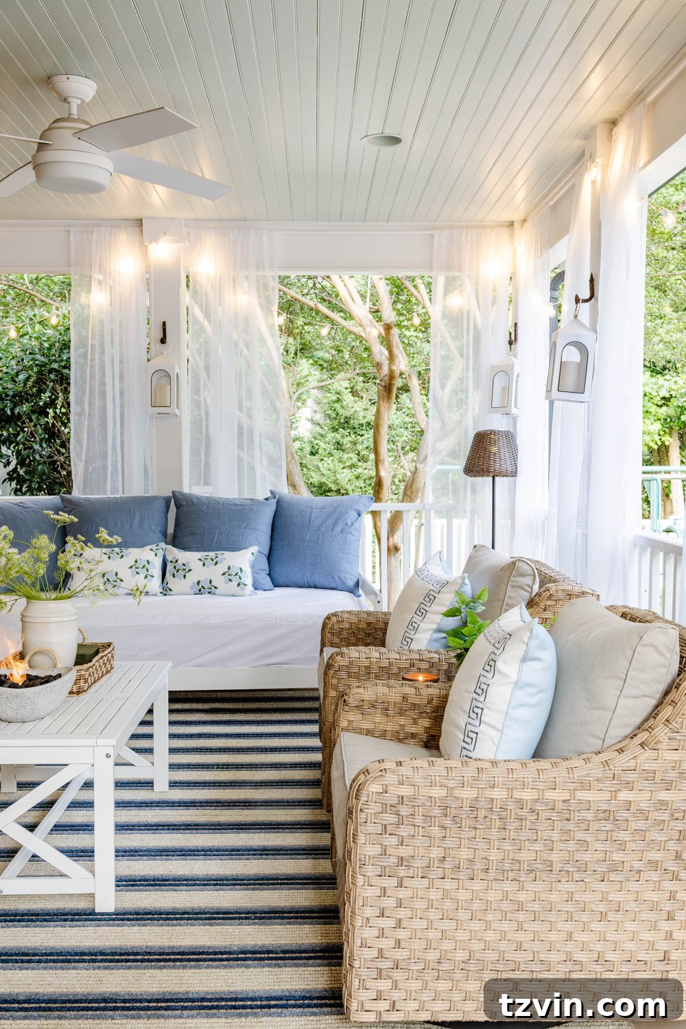 Our DIY Outdoor Living Room: Seamlessly Extending Our Home 12 Comfortable outdoor seating area with a patterned rug and decorative pillows, creating an inviting atmosphere.