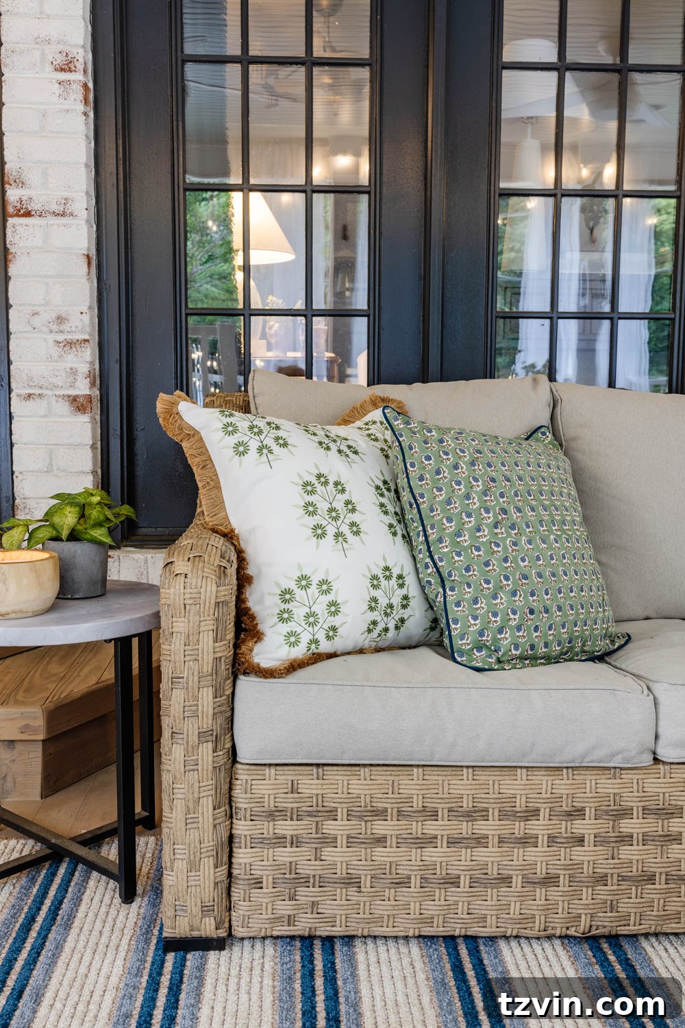 Our DIY Outdoor Living Room: Seamlessly Extending Our Home 13 Close-up of vibrant outdoor pillows on a sofa, adding color and comfort to the back porch.