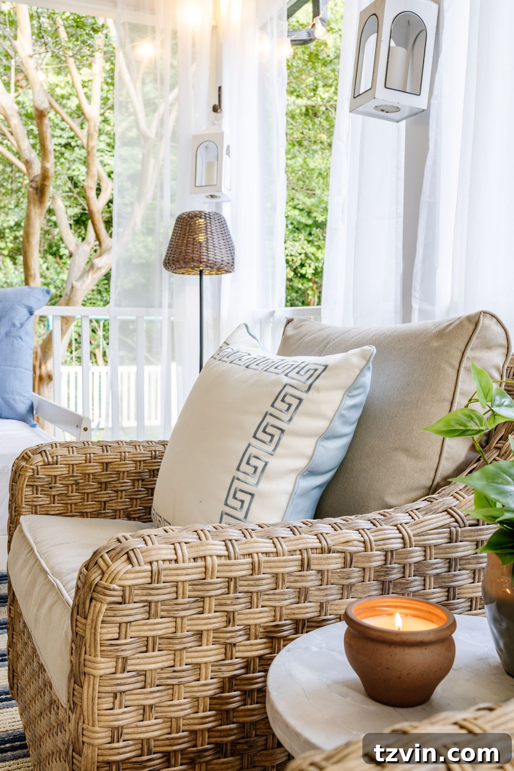 Our DIY Outdoor Living Room: Seamlessly Extending Our Home 14 Stylish outdoor living room decor, featuring a cozy fireplace and inviting throw pillows on the seating.